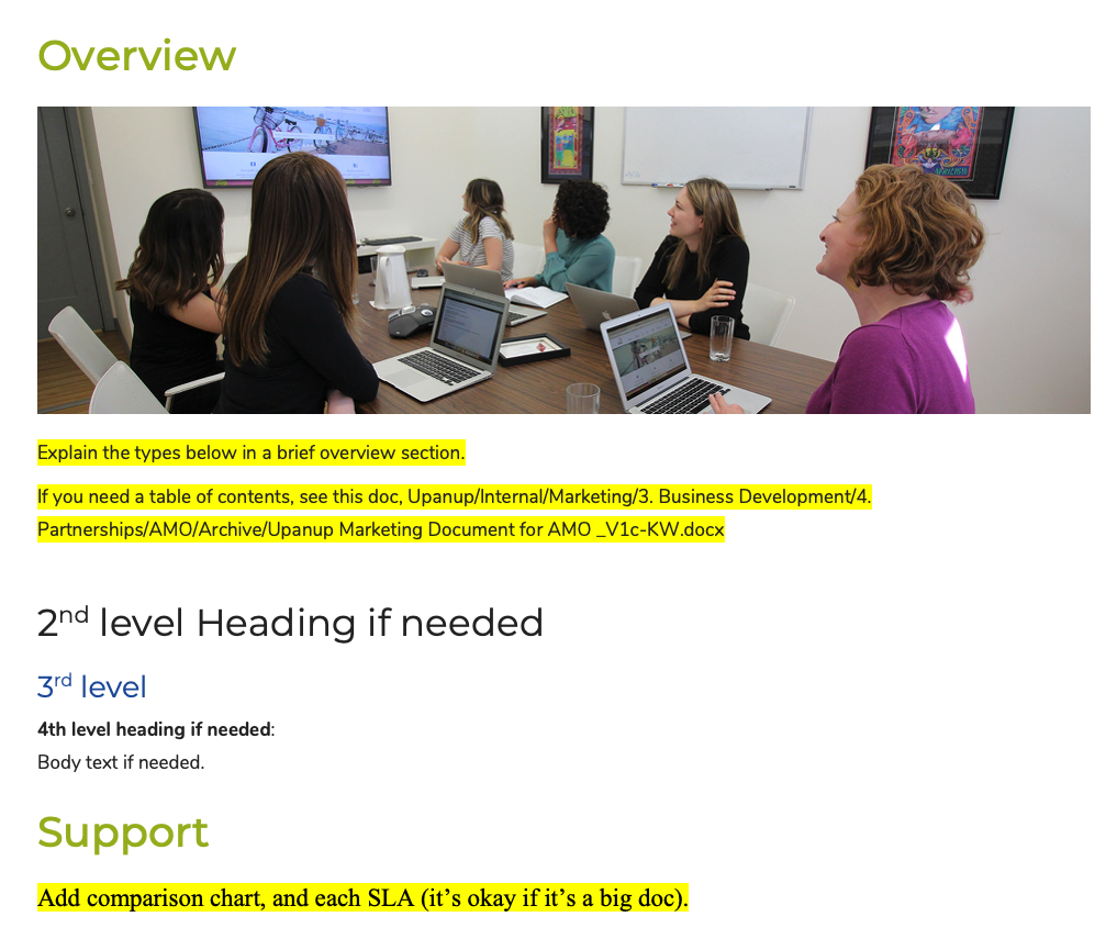 Women in a meeting room looking at a presentation on a screen.